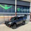 Mazda BT50 Dual Battery1 > 4wd Lights and Camping Online Store Mazda BT50 2022+ dual battery system with Australian-Made tray and lithium setup mounted behind the rear seat for clean, reliable 12V power.