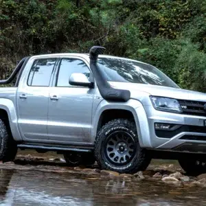 Safari SS1400HF V-Spec snorkel fitted to Volkswagen Amarok driving through shallow water.