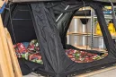 Roof top tent interior showing sleeping area and bedding